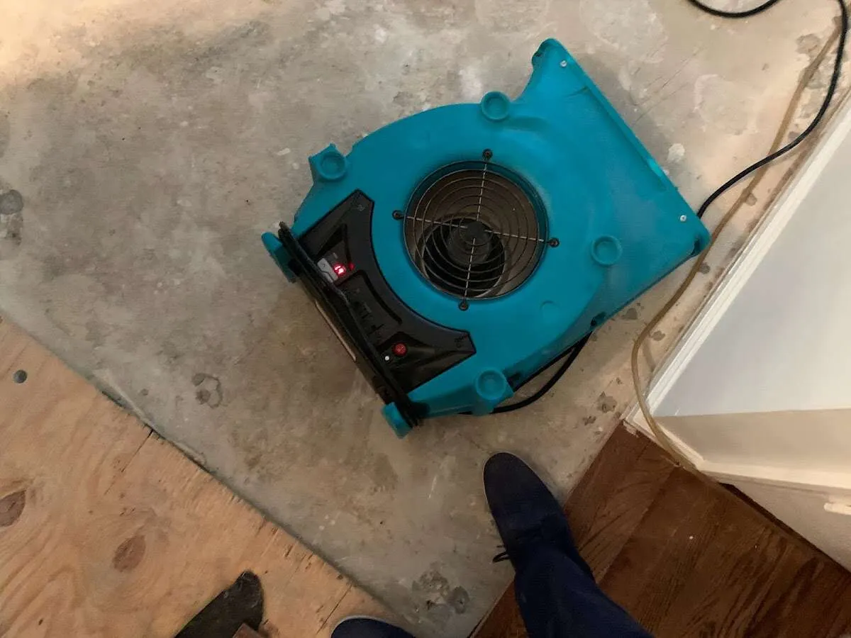 Air mover drying subfloor during Leak Detection & Repair in Sugar Hill